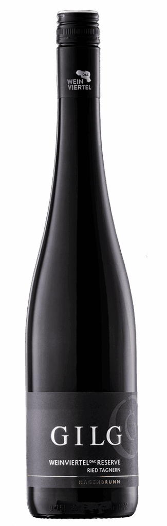 Eine dunkle Glasflasche GILG Weinviertel DAC Rexerve Ried Tagnern mit schwarzem Etikett und silbernem Text, gekrönt von einem versiegelten schwarzen Deckel mit silbernem G-Logo.